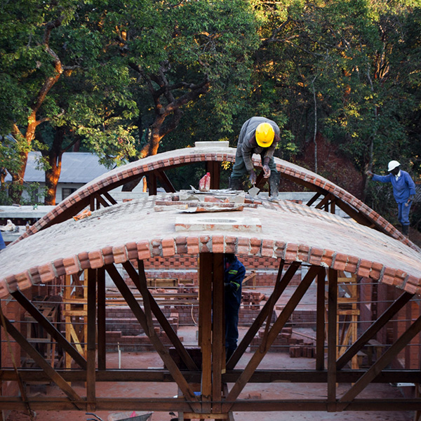 Cement stabilised earth bricks, CSEB, create new arch vaults for new hospital in Zambia.